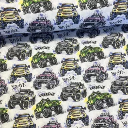 Fehér alapon színes monster truckos pamutvászon
