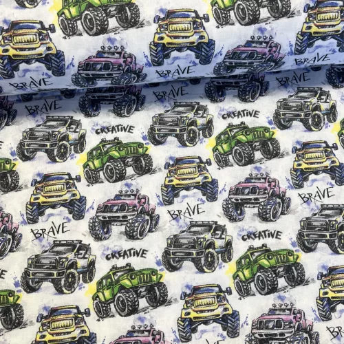 Fehér alapon színes monster truckos pamutvászon